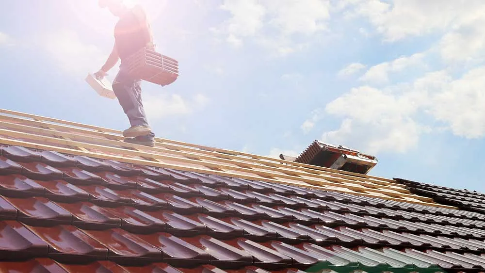 one of our team repairing a roof