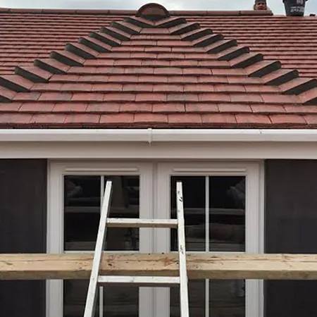 gutter and red brick tiles